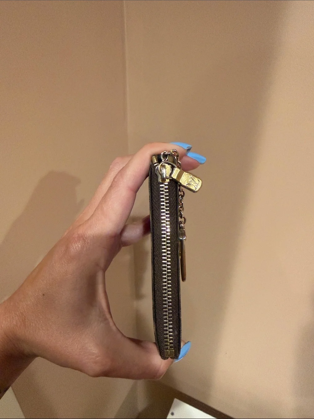 Louis Vuitton holder chain discolored